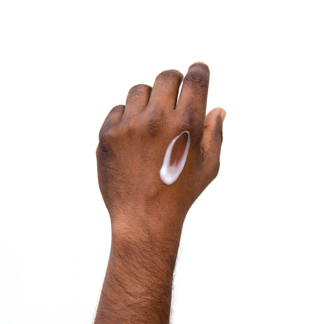 PRIORI DNA Recovery Face Serum Product consistency shown on model's hand 4
