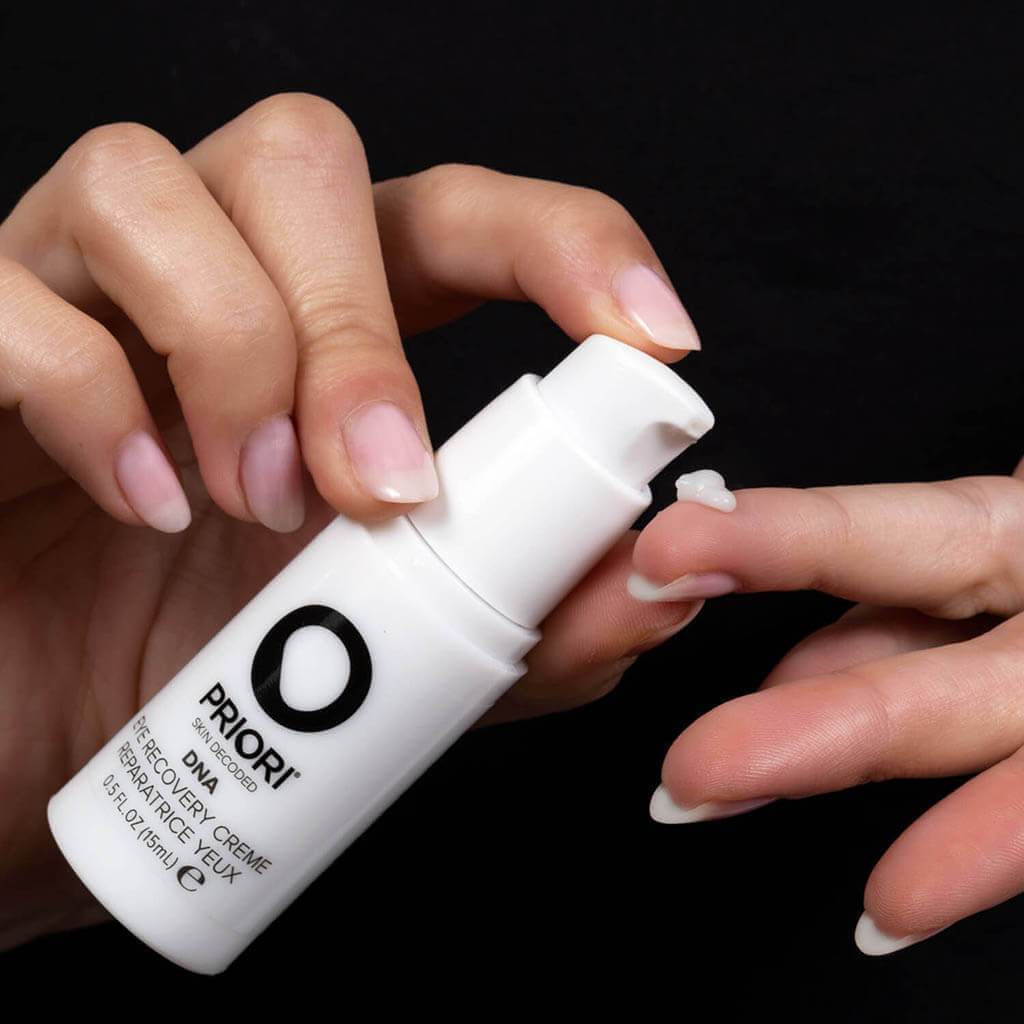PRIORI DNA Eye Recovery Cream Consistency shown on model finger 3