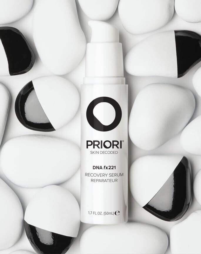 PRIORI DNA Recovery Face Serum Product amongst white and black rocks 5