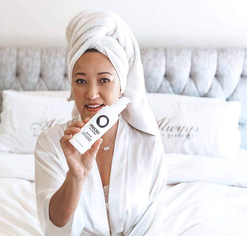 PRIORI LCA Daily Gentle Facial Cleanser with model in a professional skincare spa 3